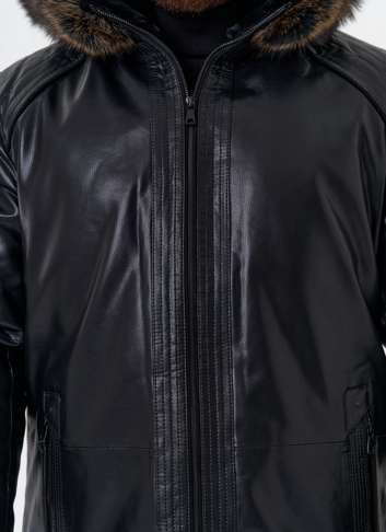 Пуховик из эко кожи с капюшоном из меха енота